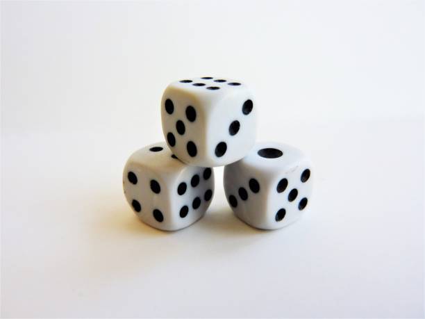 istock Closeup shot of a stack of dice isolated on a white background 1437479123