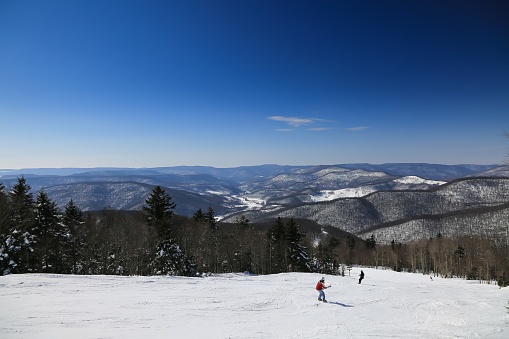 A horizontal shot of a snowscape taken on the top of Snowshoe Mountain at Snowshoe Ski Resort in West Virginia in February