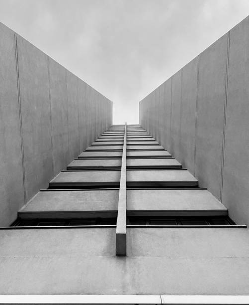 Grayscale shot of a tall building