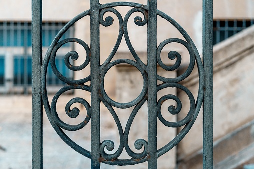 Old metal gate at the entrance of an old mansion