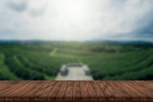 istock wooden table and beauty blur sky and mountains as background. 1437489636