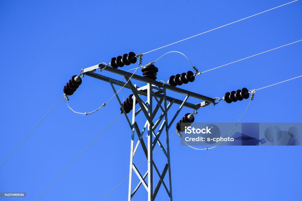 Electricity pylon with clear sky background Cable Stock Photo
