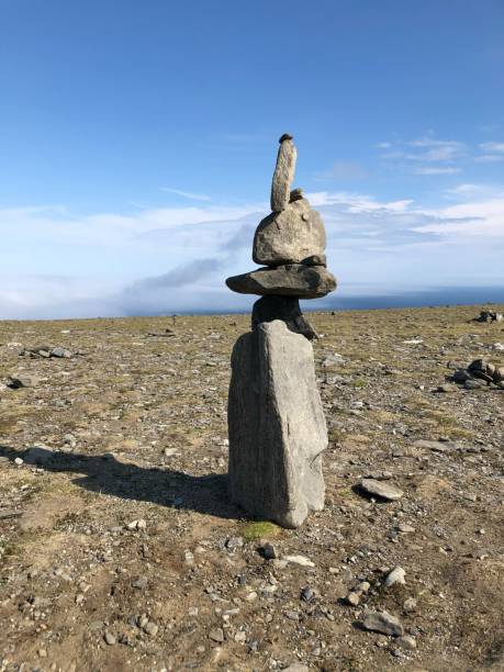 istock Vertical shot of rock balancing on the beach 1437492293