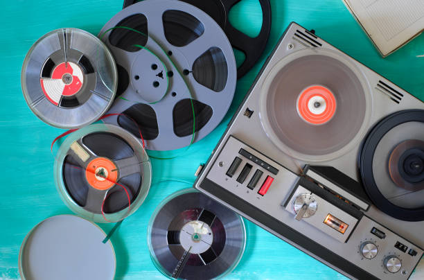 Vintage audio reel to reel tape recorder and magnetic recording tapes, flat lay stock photo