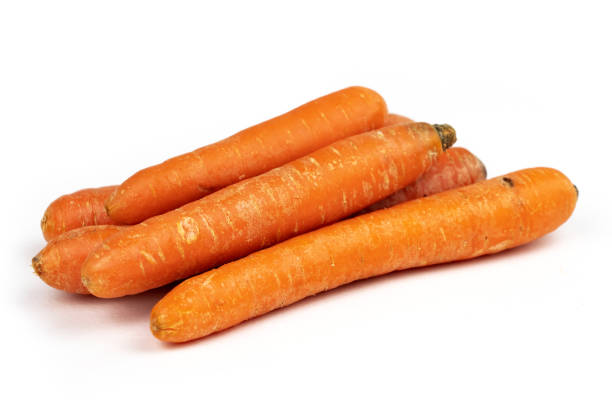 istock Heap of fresh carrots on white background 1437493465
