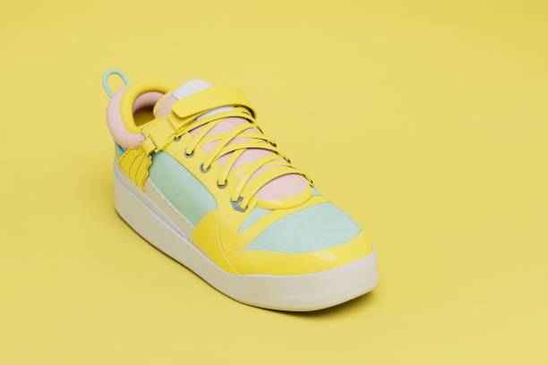 istock White sports sneaker with yellow inserts and laces on a yellow background. 3D render 1437495780