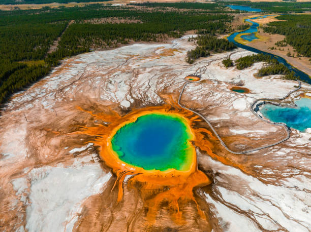 Grand Prismatic Pool at Yellowstone National Park Colors Aerial view of Grand Prismatic Spring in Midway Geyser Basin, Yellowstone National Park, Wyoming, USA. It is the largest hot spring in the United States midway geyser basin photos stock pictures, royalty-free photos & images