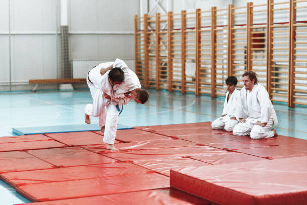 istock Judo Player Executing Throw Of Opponent During Sparring 1437502058