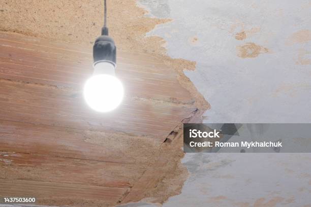 Interior Reconstruction On Ruined Old Ceiling And Hanging Lamp On Fixing Repair Aged Architecture Retro Design Stock Photo - Download Image Now