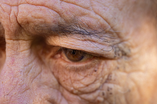 Close up view of a brown eye of a senior man