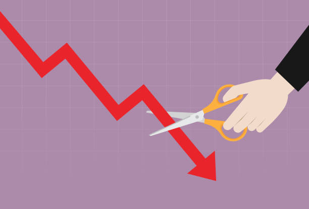 istock The investor uses scissors to cut a stock market graph 1437505733
