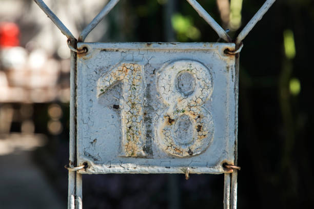 istock Old retro cast iron plate number 18 1437509118
