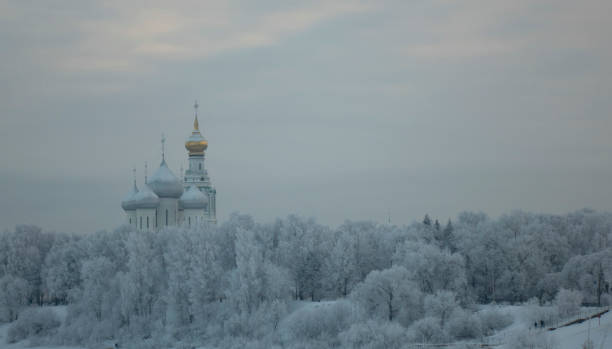 Christian church in the winter forest, on a snowy cold winter day stock photo