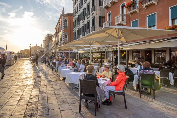Empty outdoor cafe scene with wooden tables and chairs