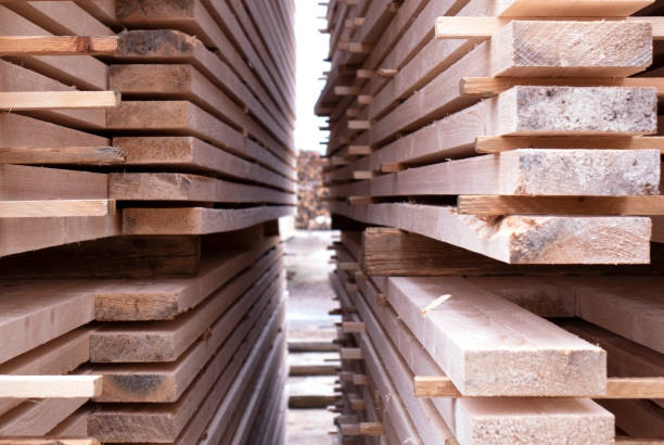 Lumber warehouse. Wooden boards in a stack stock photo