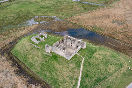 Aerial drone view of the ruin of Ruthven Barracks in Badenoch, in the Scottish Highlands, close to the town of Kingussie. Built in 1719 after the 1715 Jacobite uprising, it was later destroyed by Jacobites retreating after the Battle of Culloden in 1746.