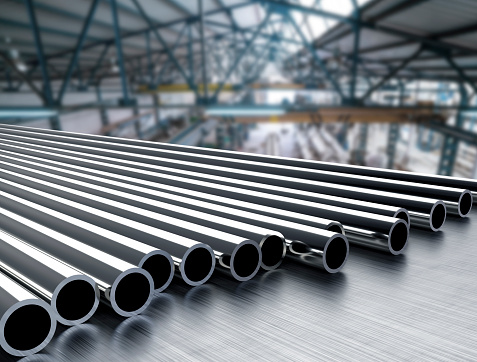 Steel shiny pipes in a row tubes 3d illustration with perspective on indoor industry metal factory