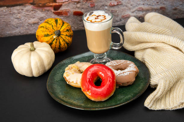 istock Halloween Pumpkins and Colorful Donuts 1437513690