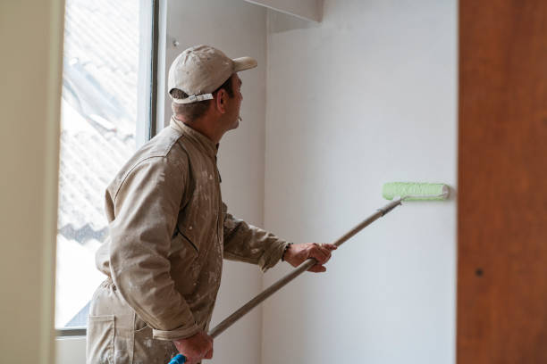 istock Worker makes improvements to the house where he is working while wearing his uniform and accessories to work 1437513786