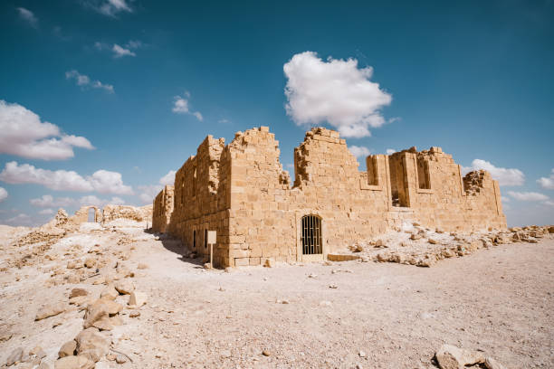 Ancient settlement ruins in Desert Landscape in Middle East. Surreal view of remote location during the day.