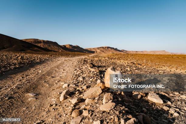 Road Marking In Desert Landscape In Middle East Stock Photo - Download Image Now - Dirt Road, Middle East, Mining - Natural Resources