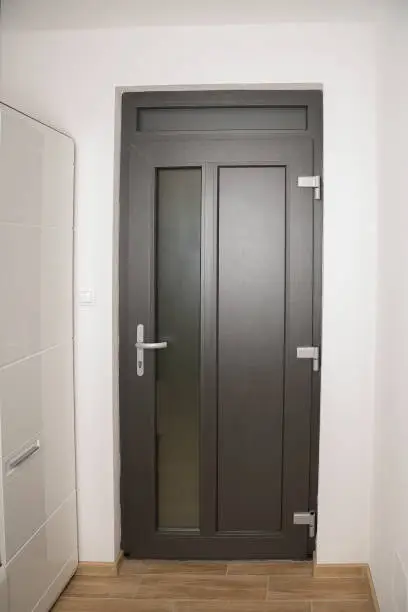 Gray enterance door in a private house