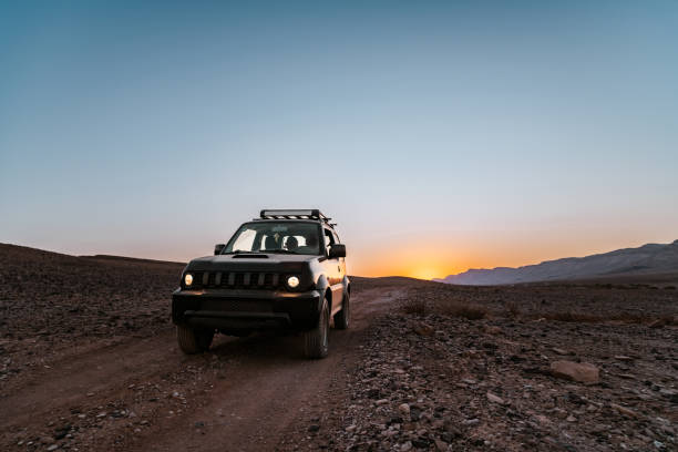 istock Small SUV in Desert Landscape in Middle East 1437515298