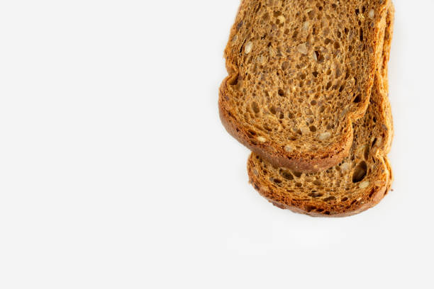 istock whole grain bread slices on white background, copy space, supermarket products 1437515675