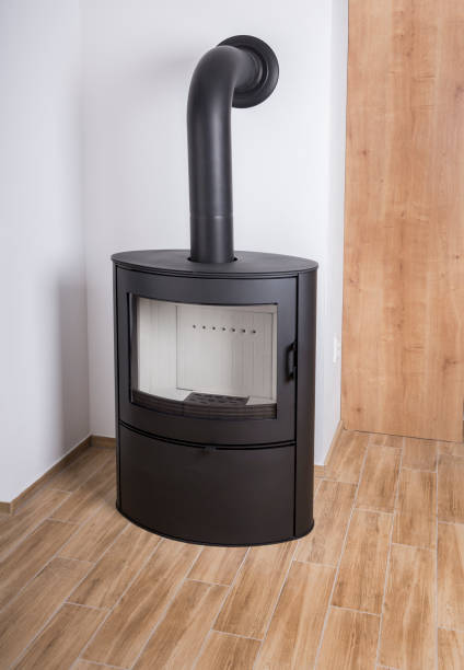 istock New black iron Wood Burning Stove on a ceramic tiles floor 1437517076