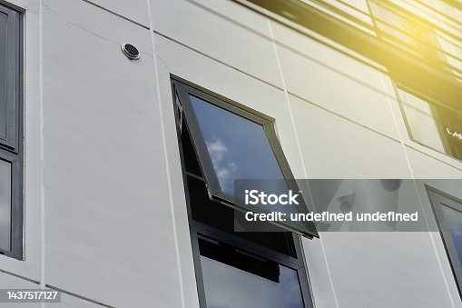 istock Black frame aluminium windows of building. 1437517127