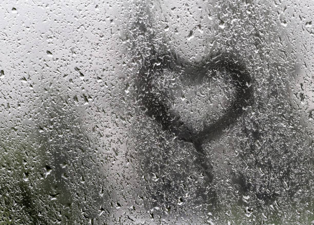 istock Heart painted on wet window. 1437518826