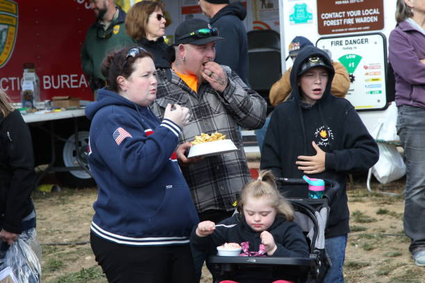 Eating French Fry The Sandwich Fair Held annually at Sandwich, NH, US on Columbus Day Weekends, October 8 - 10, 2022. The Grand Street Parade. sandwich new hampshire stock pictures, royalty-free photos & images