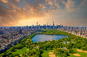 Central park in New York with golf fields and tall skyscrapers surrounding the park