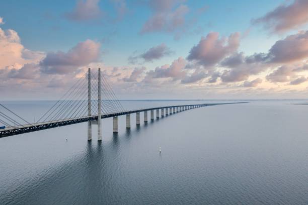 Oresundsbron bridge connecting Denmark and Sweden over the sea The Oresundsbron bridge connecting Denmark and Sweden over the sea oresund bridge stock pictures, royalty-free photos & images