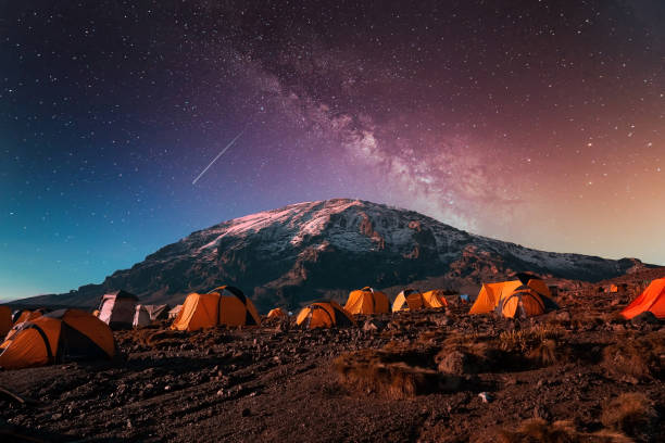 Campsite on Kilimanjaro mountain background under the Milky Way A campsite on Kilimanjaro mountain background under the Milky Way kilimanjaro stock pictures, royalty-free photos & images