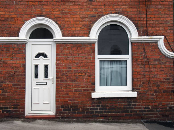 istock white front door and window of a typical old brick british terraced house with white decorative paintwork 1437525581