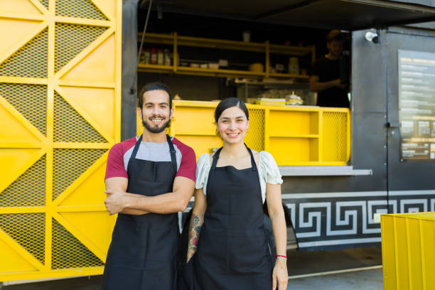 istock Food truck workers working preparing fast food 1437526013