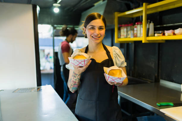 istock Cheerful woman cook finishing preparing fast food 1437526310