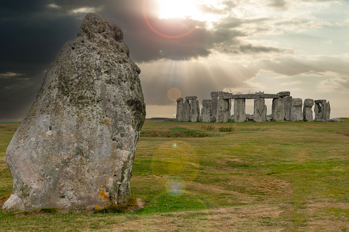 Daytime view of the Heel Stone and stone circle at Stonehenge, a UNESCO World Heritage site near Amesbury in Wiltshire, England