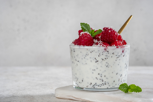 Chia pudding with coconut milk and raspberry with mint