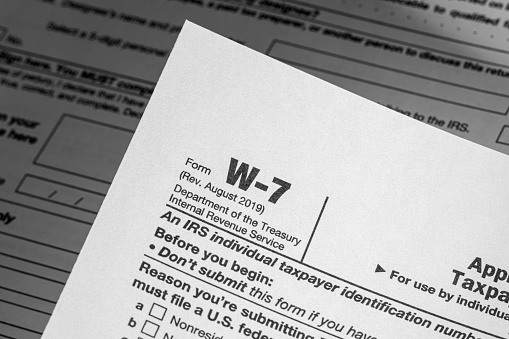 Tax form W-4 Employee Withholding Certificate, business finance concept.
