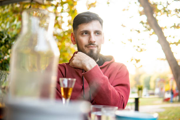 istock Caucasian guy sitting at a table in a cafe 1437532038