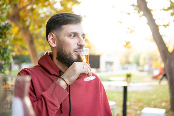 young man enjoys a meal in a Greek restaurant