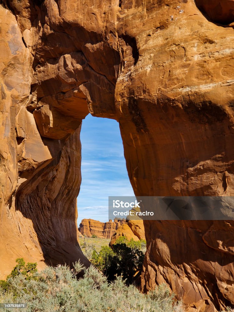 Arch Behind Small Window Arch With Cliffs Behind Arches National Park Utah Stock ...
