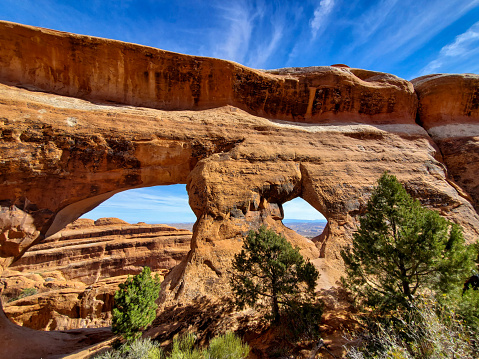 Double window arch in a sandstone wall. Arches National Park, Utah.