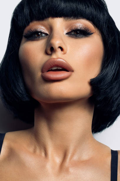 Close-Up Side View Of Young Woman Looking Through Keyhole