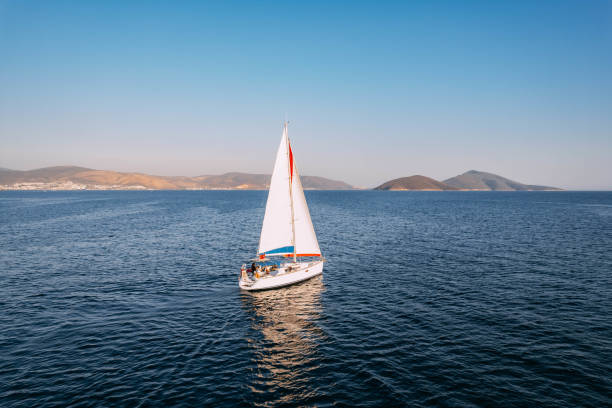 istock Aerial View Sailboat Moving on the Sea 1437537888