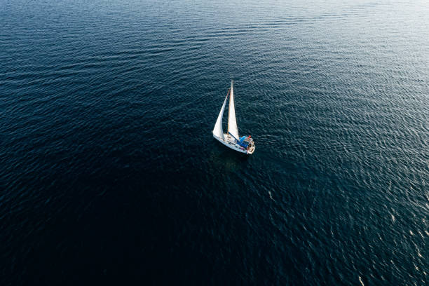 istock Aerial View Sailboat Moving on the Sea 1437537919