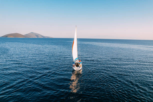 istock Aerial View Sailboat Moving on the Sea 1437537927