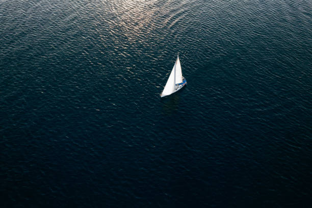 istock Aerial View Sailboat Moving on the Sea 1437537961